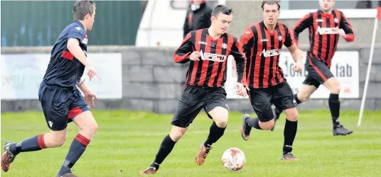  ??  ?? Julian Williams (in possession) hit four goals for Porthmadog at Mold Alexandra last weekend