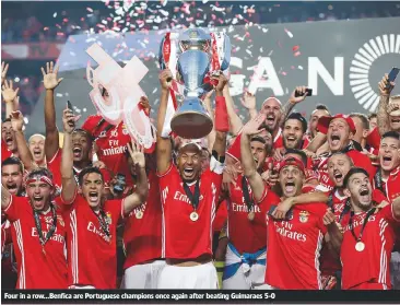  ??  ?? Four in a row...Benfica are Portuguese champions once again after beating Guimaraes 5-0
