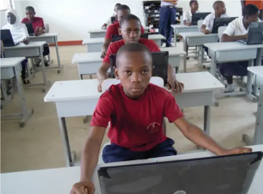  ??  ?? Students are provided with laptops in a Hope Primary School in Tanzania