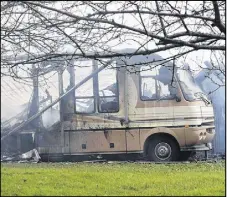  ?? HARRY suLLIVAN – tRuRO DAILY NEWs ?? A charred shell was all that was left of a large motor home, destroyed along with a residence and attached garage on Five Point Road.