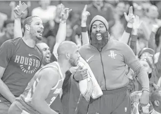 ?? Elizabeth Conley / Houston Chronicle ?? A big part of the Rockets’ success comes from the relationsh­ip between guard James Harden, right, and Chris Paul, center, star guards who have meshed seamlessly, much to the NBA’s dismay.