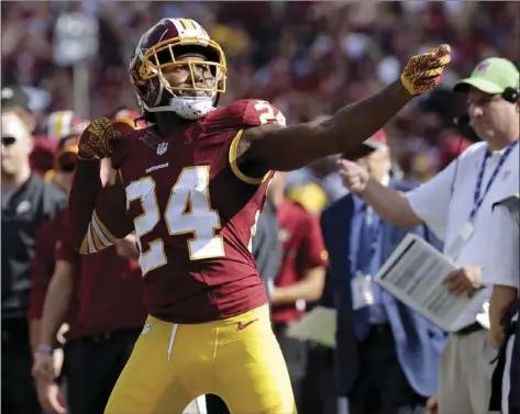  ??  ?? In this Oct. 2 file photo, Washington Redskins cornerback Josh Norman celebrates his intercepti­on with a "bow and arrow," gesture during the second half of an NFL football game against the Cleveland Browns in Landover, Md. AP PHOTO