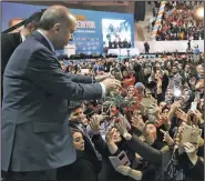  ?? AP/KAYHAN OZER ?? Turkish President Recep Tayyip Erdogan throws carnations to his supporters Saturday during a gathering in Kocaeli, Turkey.