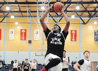  ?? METROLAND FILE PHOTO ?? Ridley College’s Jaden Bediako, seen in the 2016 Region of Peel all-star basketball game, is among 17 players invited to training camp for the national under-18 men’s team.