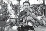  ?? [AP PHOTO] ?? Shane Pliska, owner of Planterra, a commercial florist and owner of a wedding venue where the décor is all about flowers and plants, poses for a photo at his company in West Bloomfield, Mich.