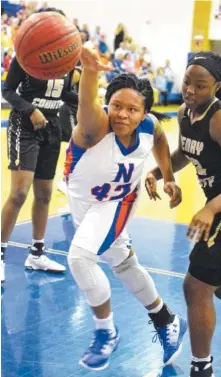  ?? STAFF PHOTO BY ROBIN RUDD ?? Northwest Whitfield’s Jada Griffine (42) tries to pull in a loose ball under the basket against the Henry County Lady Warhawks.