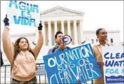  ?? JACQUELYN MARTIN AP FILE ?? Bethsaida Sigaran (left), Jaime Sigaran and Thea Louis rally in support of the Clean Water Act in 2022.