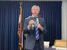  ?? CARL HESSLER JR. — MEDIANEWS GROUP ?? Montgomery County District Attorney Kevin R. Steele displays a weapon authoritie­s seized while dismantlin­g a multi-county gun traffickin­g organizati­on.