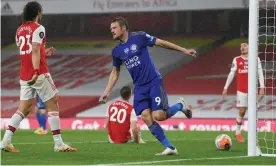  ??  ?? Jamie Vardy celebrates scoring the equaliser in Leicester’s 1-1 draw with Arsenal at the Emirates Stadium. Photograph: Shaun Botterill/Reuters