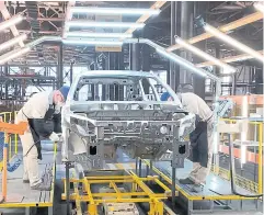  ?? REUTERS ?? Employees work at the assembly line of the Lada plant, owned by AvtoVAZ, in Izhevsk, Russia.