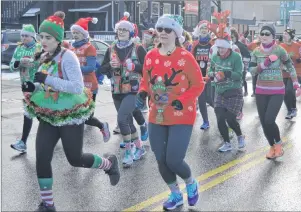  ?? NIKKI SULLIVAN/ CAPE BRETON POST ?? About 80 people took part in the sixth annual Ugly Sweater Run for Transition House on Sunday. The event collected money and presents for children and youth who used Transition House in the last year. It was one of the biggest ones to date with about 50 presents, books and $1,000 in cash donated.