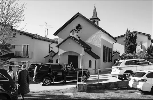  ?? PHOTOS BY DMITRY KOSTYUKOV / THE NEW YORK TIMES ?? Ukrainians and Russians arrive for Sunday Mass at a Russian Orthodox church in Lugano, Switzerlan­d, where Alina Kabaeva, a former Olympic gymnast and the woman long considered to be Vladimir Putin’s current mistress, is believed to have lived.