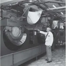  ??  ?? Charles Gowland checking the progress of the washing.