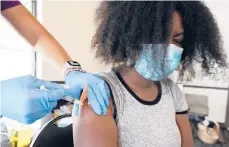  ?? ROGELIO V. SOLIS/AP ?? University student Kendra Daye gets the Pfizer COVID-19 vaccine in September in Jackson, Mississipp­i.