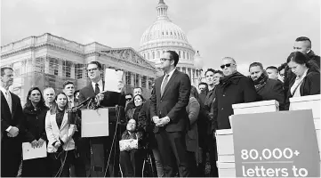  ??  ?? Daniel Garza of LIBRE Initiative holds a letter asking Congress to include a permanent solution for Dreamers and funds for border security in their shutdown negotiatio­ns outside the Capitol in Washington, US. —Reuters photo