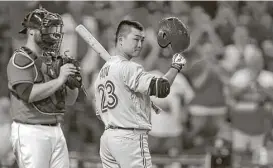  ?? Karen Warren / Houston Chronicle ?? Blue Jays outfielder Nori Aoki tips his batting helmet to the fans cheering him during the ninth inning at Minute Maid Park on Friday.