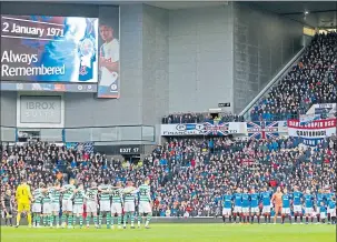  ??  ?? Rangers and Celtic players pause in silent tribute at an Old Firm in 2018 to the 66 people who died in the tragedy at Ibrox Stadium in 1971