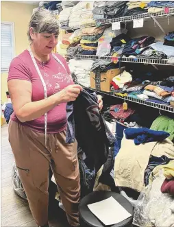  ?? COURTESY ?? For three years now, Leigh Reynolds has kept the clothes closet at Clifton Sanctuary Ministries organized and sorted. It’s “a labor of love,” she said.