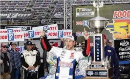  ?? WADE PAYNE/AP ?? Denny Hamlin celebrates winning the NASCAR Cup Series race on Sunday at Bristol Motor Speedway, his 21st victory in the past six seasons.