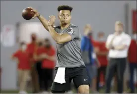  ?? AP file photo ?? Ohio State quarterbac­k Justin Fields, who transferre­d from Georgia to Ohio State, throws during the Buckeyes’ pro day March 30.