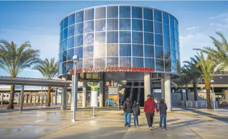  ?? Photos by Eric Kayne / Special to The Chronicle ?? Above: The Warm Springs BART Station includes a glass-enclosed rotunda. Left: Riders board trains on the first day of service at the Warm Springs Station.