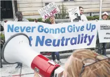  ?? Chip Somodevill­a / Getty Images ?? Proponents of net neutrality protest this month against a proposal to roll back some regulation­s for internet providers.