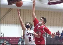  ?? MEDIANEWS GROUP PHOTO ?? Garnet Valley’s (2) Carl Schaller hits a layup ahead of Upper Dublin defender Drew Stover (42) in the District 1-6A playoffs.