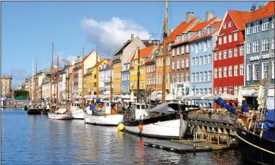  ?? (Rick Steves) ?? The colorful Nyhavn neighborho­od is the place to moor on a sunny day in Copenhagen.