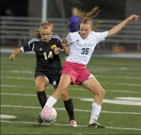  ?? Bill Wade/Post-Gazette ?? Pine-Richland's Amanda Kalin, right, battling Sarah Chomos of North Allegheny for control of the ball in a match last season, is a soccer and basketball standout selected the North Xtra Female Athlete of the Year.