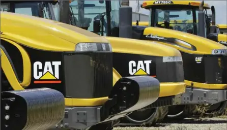  ?? ASSOCIATED PRESS FILE PHOTO ?? Caterpilla­r Inc. is headquarte­red in Peoria, Ill., and still employs more than 12,000 workers in the area, even after several layoffs.