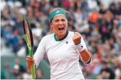  ?? THE ASSOCIATED PRESS ?? Latvia’s Jelena Ostapenko clenches her fist after scoring a point against Denmark’s Caroline Wozniacki during their Tuesday quarterfin­al match of the French Open tennis tournament at the Roland Garros stadium in Paris, France.