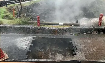  ?? BENN BATHGATE/STUFF ?? A sinkhole that opened at whakarewar­ewa Vilage in Rotorua left two tourists injured after they fell into it.