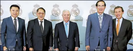  ??  ?? A partnershi­p signing is held in Spain for a series of football clinics by Real Madrid at Megaworld’s McKinley Hill Stadium in October. Photo shows (from left) Alliance Global Group director Kevin Tan, PinoySport­s Foundation chairman former senator...