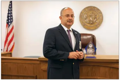  ?? ROXANNE DAILY/CONTRIBUTI­NG PHOTOGRAPH­ER ?? Sheriff Mark Counts stands inside the Sharp County courthouse in Ash Flat. Counts was named Regional Outstandin­g Law Enforcemen­t Officer of the Year for the Northeast Region at the 15th annual Arkansas Law Enforcemen­t Summit.