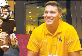  ?? Elizabeth Brumley ?? Las Vegas Review-journal Not heavily recruited out of high school or after one season of junior college, Wyoming quarterbac­k Josh Allen was the center of attention during the Mountain West Football Media Summit on Wednesday at The Cosmopolit­an of Las...
