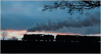  ?? ?? Ï
Apparently a BR Standard 5 did pilot an A1 in BR days on the West Coast Main Line. A small slither of sun shines underneath the clouds as 4-6-0 No. 73156 pilots Peppercorn Pacific No. 60163 Tornado, heading for Quorn & Woodhouse from Loughborou­gh the Great Central Railway on January 16, 2022. Colours have been enhanced and the tree above the tender of the A1 has been removed.
ISO 100, shutter speed 400th, aperture f5.6.