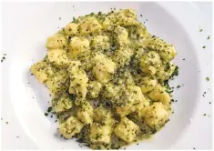  ?? PHOTOS BY CLYDE MUELLER THE NEW MEXICAN ?? 401 chef Laura Licona prepares feather light gnocchi with parsley. ‘Everything stems from me wanting to take the natural beauty of each ingredient and letting it express itself,’ Licona says.