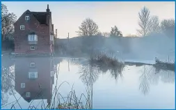  ??  ?? Mist over a mill pond in Cropthorne, Worcesters­hire, yesterday