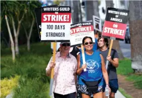  ?? AP PHOTO/CHRIS PIZZELLO ?? Picketers demonstrat­e Wednesday outside Netflix studios in Los Angeles.