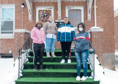  ?? KASSI JACKSON/HARTFORD COURANT ?? Raquel Smith, second from left, stands with three of her five children, Raquel Edwards, 17, left, Khamari Smith, 11, and Samara Edwards, 15, outside their Hartford home Feb. 3.