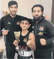  ??  ?? Coaches Omar Shaheen and Shaz Khan with Saif Ali