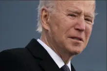 ?? Evan Vucci/Associated Press ?? President-elect Joe Biden tears up as he bids farewell to his home state of Delaware on Tuesday at the Major Joseph R. “Beau” Biden III National Guard/Reserve Center.