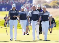  ?? ALASTAIR GRANT/ASSOCIATED PRESS ?? Jordan Spieth, left, Tiger Woods, center, foreground, and Justin Thomas, right, walk to the 18th green during a practice round Wednesday at Le Golf National in France.