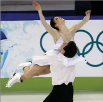  ?? ROBERT SKINNER, THE CANADIAN PRESS ?? Canada’s Tessa Virtue and Scott Moir perform their free dance in the ice dance competitio­n at the 2010 Vancouver Olympic Winter Games. Virtue competed despite a serious leg injury.