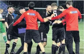  ??  ?? Party time Thistle Amateurs celebrate on the pitch after clinching the trophy