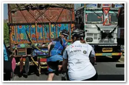  ??  ?? Riders encounter traffic chaos in Rajasthan.