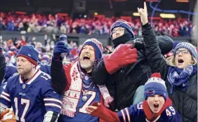  ?? Brett Carlsen / Getty Images ?? Bills fans attending Saturday’s wild-card playoff game against the Colts will first undergo drive-thru COVID-19 testing in the stadium’s parking lot.