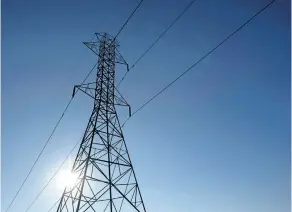  ?? THE CANADIAN PRESS FILES ?? A hydro tower is shown in Toronto. Hydro One Ltd. has signed a friendly deal to acquire U.S. energy company Avista Corp. for C$6.7 billion in an all-cash deal.