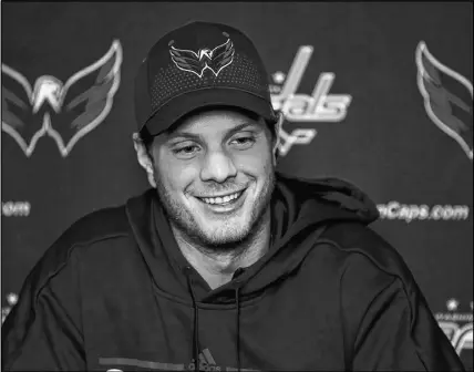  ?? AP PHOTO ?? Washington Capitals’ John Carlson smiles during a news conference at their NHL hockey practice facility in Arlington, Va.