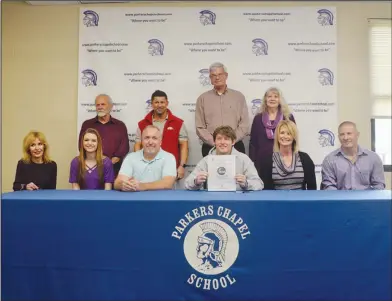  ?? Kelly Stewart/Parkers Chapel High School ?? Cushing signs: Parkers Chapel's Kade Cushing is pictured after signing to play tennis at the University of the Ozarks. A five-sport athlete, Cushing won the 2A state singles title in aiding the Trojans to their first state crown in boys tennis last fall.